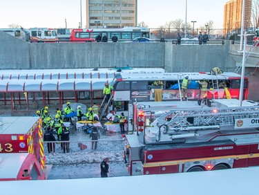 First responders attend to victims of a horrific rush hour bus crash at the Westboro Station near Tunney's Pasture.