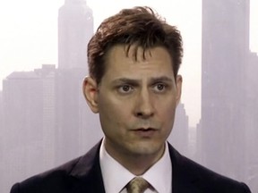 In this file image made from a video taken on March 28, 2018, Michael Kovrig, an adviser with the International Crisis Group, a Brussels-based non-governmental organization, speaks during an interview in Hong Kong. China says former Canadian diplomat Kovrig detained in China last month does not enjoy diplomatic immunity, rejecting a complaint from Canadian Prime Minister Justin Trudeau.