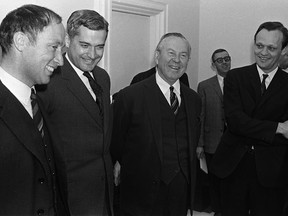 Prime Minister Lester B. Pearson (second right) and cabinet ministers Pierre Trudeau (left to right) John Turner and Jean Chretien talk in Ottawa on April 4, 1967. He was almost a decade away from becoming prime minister, but the two RCMP constables on surveillance duty that January night seemed to have no trouble recognizing Pierre Trudeau, even if they misspelled his name.THE CANADIAN PRESS/Chuck Mitchell