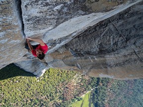 Alex Honnold is shown making the first free solo ascent of El Capitan's Freerider in Yosemite National Park, Calif., in this handout photo. Hanging onto the edge of a massive cliff without a safety harness is sheer insanity by any measure, but for free climber Alex Honnold it's merely what gets his adrenaline pumping. The thrill-seeker stunned moviegoers in the big-screen documentary "Free Solo," which tracks his relentless quest to scale Yosemite National Park's El Capitan rock formation without safety gear. But now his historic achievement is becoming even more enormous with a number of dates on Imax screens in several Canadian cities this week.