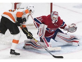 Philadelphia Flyers' James van Riemsdyk moves in on Canadiens goaltender Antti Niemi in Montreal on Saturday, Jan. 19, 2019.