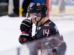 Canada's Maxime Comtois rests his head on his glove after losing to Finland during overtime quarter-final IIHF world junior hockey championship action in Vancouver on Wednesday, Jan. 2, 2019.