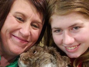 This photo provided by Jennifer Smith and used as her new Facebook proflie picture, shows 13 year old Jayme Closs (R), her aunt/godmother Jennifer Naiberg Smith (L) and Molly the dog posing together after being reunited on January 11, 2019.