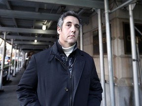 FILE - In this Dec. 7, 2018 file photo, Michael Cohen, former lawyer to President Donald Trump, leaves his apartment building in New York. Cohen is acknowledging that he paid a technology company to falsely improve Trump's standing in two online polls.