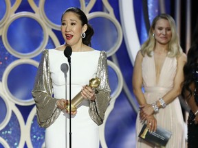 This image released by NBC shows Sandra Oh accepting the award for best actress in a drama series for her role in "Killing Eve" during the 76th Annual Golden Globe Awards at the Beverly Hilton Hotel on Sunday, Jan. 6, 2019 in Beverly Hills, Calif.