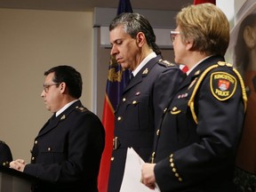 RCMP Supt. Peter Lambertucci, left, and Chief Supt. Michael LeSage, centre, and Kingston Police Chief Antje McNeely brief the media about a pair of police raids Thursday afternoon that resulted in the arrest of two people.