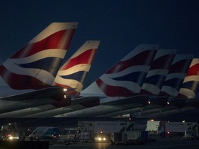 Passenger aircraft operated by British Airways stand at Terminal 5 at London Heathrow Airport in London, U.K., on Monday, Dec. 24, 2018.
