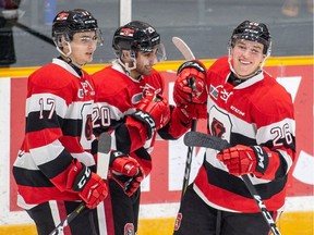 Rookie Ottawa 67's defenceman Alec Belanger (26) celebrates with teammates after scoring his first OHL goal on Saturday, Jan. 19, 2019 at the TD Place arena.