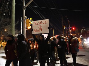 Dozens of people attend a vigil on Friday evening, Feb. 1, 2019, to mark the Feb. 4 start of the criminal trial of Abdirahman Abdis death. The crowd gathered at Somerset Square Park, then walked to Bayview Yards for speeches, prayers and calls to action.