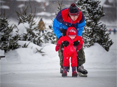 20-month-old Seamus Harbic gets a little help from Rob Harbic on his first day on the canal during Winterlude Sunday Feb. 3, 2019.
