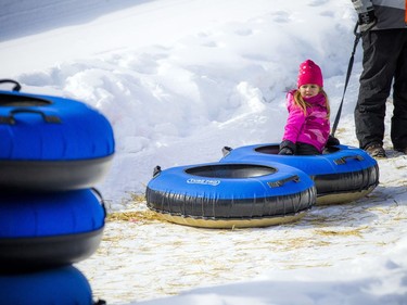 People enjoyed the sunshine in the Snowflake Kingdom in Jacques-Cartier Park Sunday Feb. 10, 2019 part of the Winterlude festivities.  Three-year-old Reese Esler took the smart way up the hill of the super slide.