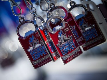 Finisher medals hang in the sun at the finish line of the Gatineau Loppet, Saturday Feb. 16, 2019.