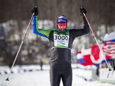 27km race first place winner Luc Campbell crosses the finish line at the Gatineau Loppet, Saturday Feb. 16, 2019.