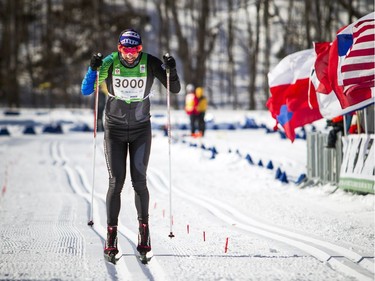 27km race first place winner Luc Campbell crosses the finish line at the Gatineau Loppet, Saturday Feb. 16, 2019.