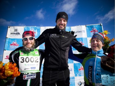 From left: second place Yanik Leduc, first place Luc Campbell and third place in the 27km race Michel Labrie on the podium at the Gatineau Loppet, Saturday Feb. 16, 2019.   Ashley Fraser/Postmedia
