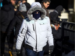 One of the thousands of people in downtown Ottawa to participate in activities on the final weekend of Winterlude for 2019.