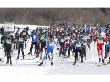 Skiers leave the start of the 27km free technique cross-country ski race at the Gatineau Loppet on Sunday, February 17, 2019.