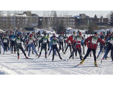 Skiers leave the start of the 27km free technique cross-country ski race at the Gatineau Loppet on Sunday, February 17, 2019.
