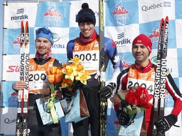 First place Andy Shields, centre, second place Francis Izquierdo-Bernier, left, and David Gregoire, right, take part in the men's 51km free technique cross-country ski race at the Gatineau Loppet on Sunday, February 17, 2019