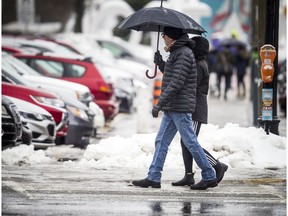 Ottawa was hit with rain and freezing rain causing a mess on the roads and sidewalks throughout the city Sunday Feb. 24, 2019.   Ashley Fraser/Postmedia