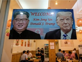 A signboard in a Hanoi restaurant marks next week's summit between U.S. President Donald Trump and North Korean leader Kim Jong-un.