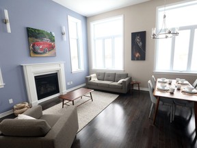 In the bungalow, a cosy living and dining room feels roomier thanks to its 12-foot ceilings, one of just three upgrades on this side of the house.