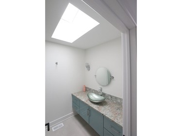 One of three full bathrooms upstairs, the skylight in this one brings welcome natural light while maintaining privacy.