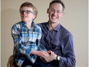 Warren Barker and his nine-year-old son Quinn Barker-Brown at their Barrhaven home.