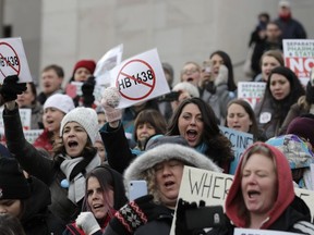 A February 9 photo of anti-vaccination protesters at the State Capitol in Olympia, Washington. Amid a measles outbreak, state legislators are looking to remove parents' ability to exempt their school-age children from immunization.