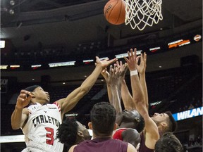 The Carleton Ravens' Marcus Anderson outjumps everyone to retrieve a rebound against the uOttawa Gee-Gees during the Capital Hoops Classic at the Canadian Tire Centre on Friday, Feb. 1, 2019.