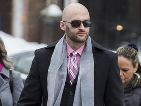 Ottawa police Const. Daniel Montsion arrives at the Ottawa courthouse for the first day of his trial for manslaughter in the death of Abdirahman Abdi on February 4, 2019.