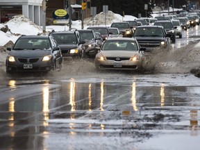 Mild temperatures have caused flooded roads throughout Ottawa including a stretch of eastbound Carling Avenue at Edgeworth Avenue on Tuesday