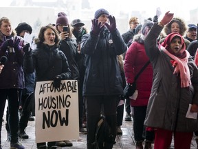Tammy Corner (holding sign) took part in a rally for affordable housing outside of Ottawa City Hall before City Council met to discuss budget 2019 on February 6, 2019.