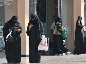 Saudi women leave a shoopping mall on November 7, 2013.