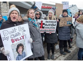 Parents protest outside MPP Lisa MacLeod's constituency office in Barrhaven.