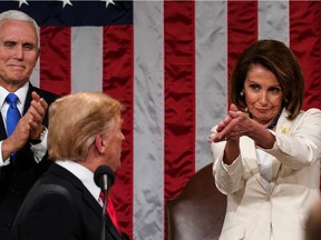 US President Donald Trump arrives to deliver the State of the Union address, alongside Speaker of the House Nancy Pelosi and Vice President Mike Pence,at the US Capitol in Washington, DC, on February 5, 2019.