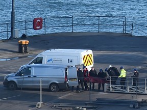 A body is taken off the Geo Ocean III, recovered from the wreckage of a plane carrying Argentine footballer Emiliano Sala at Weymouth harbour, south west England on February 7, 2019.