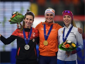 (L-R) Canada's Ivanie Blondin, Netherland's Irene Schouten and Russia's Elizaveta Kazelina pose after the winner ceremony of the women mass start competition of the ISU Speed Skating World Cup Single Distances competition on February 10, 2019 in Inzell, southern Germany.