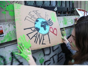 Youths, mostly high school and college students, demonstrate near the French Ministry for Ecology in Paris on February 15, 2019 against climate change, part of a Europe-wide movement that has seen walkouts in Belgium, Great-Britain, Germany, and Sweden. Where will Canadians be after October's federal election?