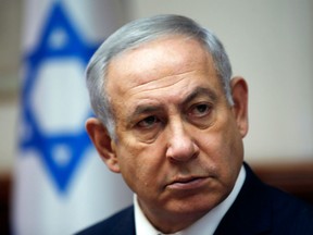 In this file photo taken on Nov. 25, 2018 Israeli Prime Minister Benjamin Netanyahu attends the weekly cabinet meeting in Jerusalem.