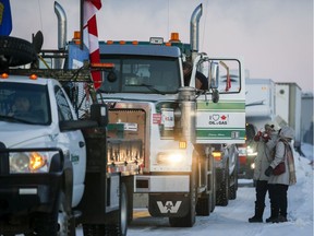 The "United We Roll" convoy of semi-trucks prepares to leave Red Deer, Alta., Thursday, Feb. 14, 2019, on its way to Ottawa to draw attention to lack of support for the energy sector and lack of pipelines.