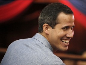 Venezuela's self proclaimed president Juan Guaido arrives for a meeting with university students at the Central University of Venezuela, in Caracas, Venezuela, Friday, Feb. 8, 2019.