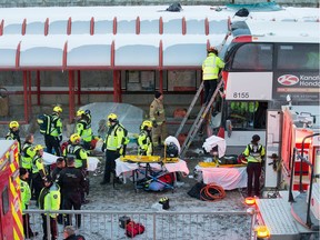 First responders attend to victims of the Jan. 11, 2019, bus crash at Westboro Station on the Transitway.