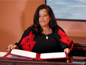 Jody Wilson-Raybould signs a book after Trudeau's cabinet shuffle, in Ottawa on Jan. 14. This week, she resigned from the federal cabinet.  REUTERS/Patrick Doyle