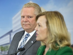Ontario Premier Doug Ford looks on as Health Minister Christine Elliott speaks at The Centre for Addiction and Mental Health in Toronto on Jan. 30, 2019.