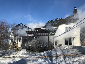 Firefighters secure structure at Dunrobin house fire.