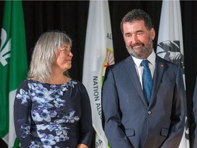 Paul Dewar appears overwhelmed as his wife, Julia Sneyd, looks on following the presentation of the Key to the City to Dewar by Mayor Jim Watson in November.