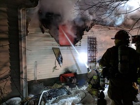 Ottawa Fire Services at the scene of a fire in a vacant house under construction on Longpré Street in Vanier Friday