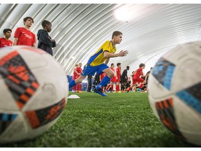 Young soccer players during a practice session following the Ottawa Fury FC launch of a new Club Affiliation Program at the Louis Riel Dome that aims to support the development of local soccer in the Ottawa-Gatineau region. The program, called "Soccer For Everyone", will provide support to players, teams and clubs in the community by increasing growth opportunities through play, talent identification, learning and teaching resources as well as access to professional facilities. Photo by Wayne Cuddington/ Postmedia