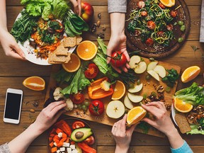 Eating healthy food, fruits and vegetables at the dinner table.